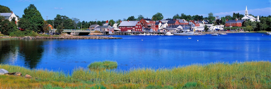 USA, Maine, Damariscotta. The quaint village of Damariscotta, in Lincoln County, Maine, is a montage of bright red and white buildings on its pretty blue harbor.