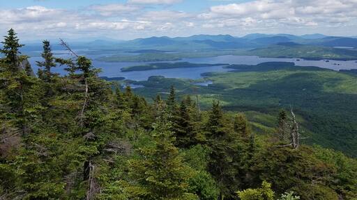 View of Moosehead Lake from the peak of Big Moose Mountain in ME. It's a tough 4.5 mile hike up a rocky creek bed with 2,000 feet in elevation gain but the view from the top is great!