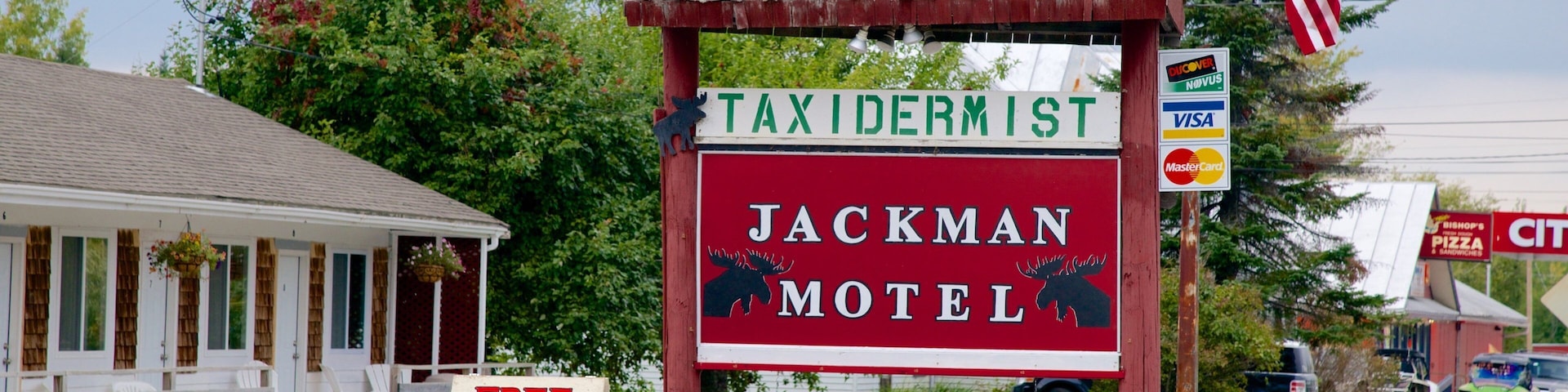 Jackman featuring a small town or village, heritage elements and signage