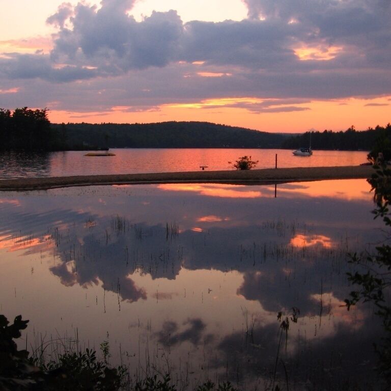 Boats waiting for sunset on Maine's Sebago Lake