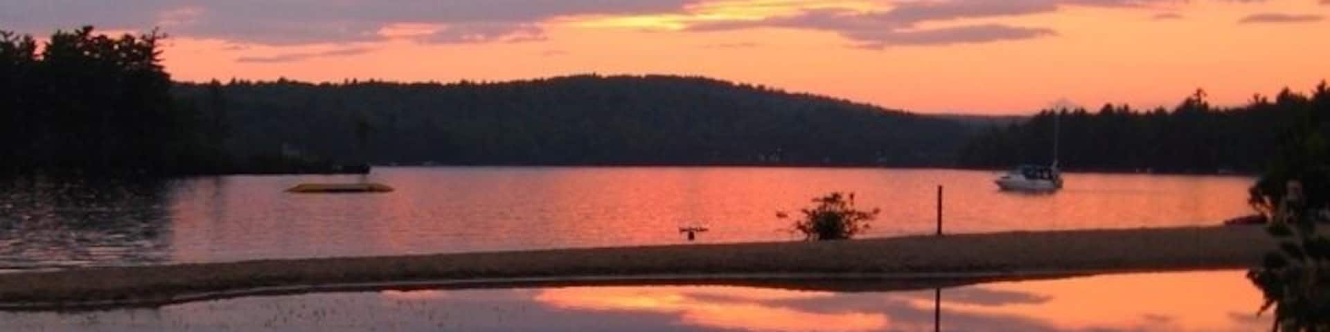 Boats waiting for sunset on Maine's Sebago Lake