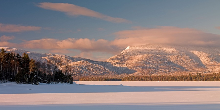Snow-covered Bigelow Mountain Range in Dead River Township is seen from Flagstaff Lake in western Maine.