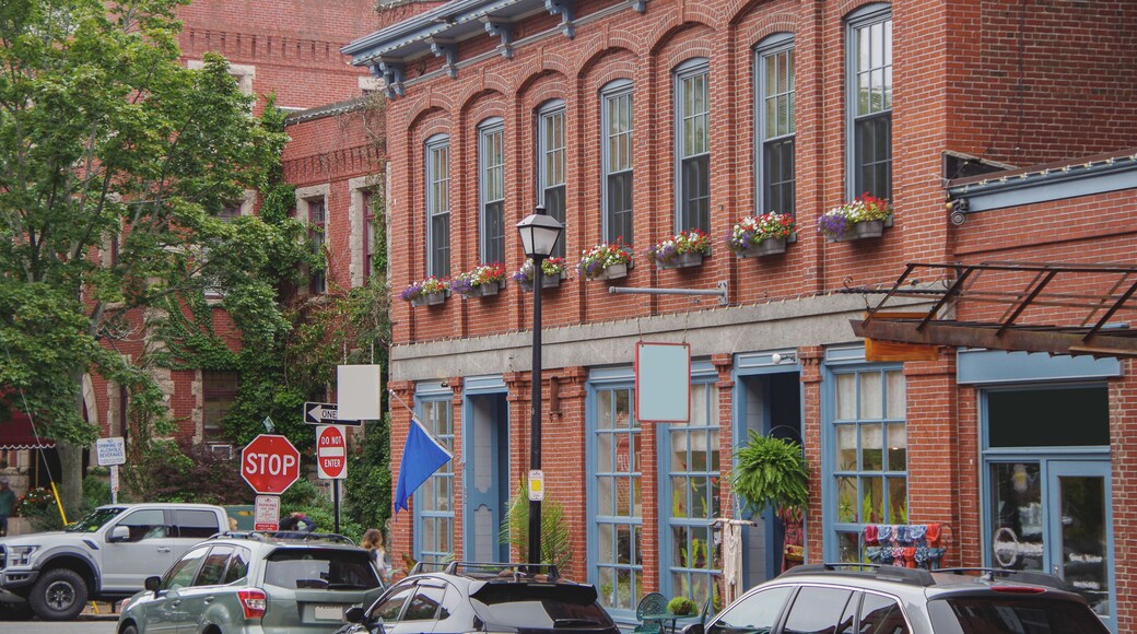 Picturesque cityscape skyline view of Portland, Maine with yacht marina, sailing boats, historic building facades, streets and urban living coast fisher atmosphere