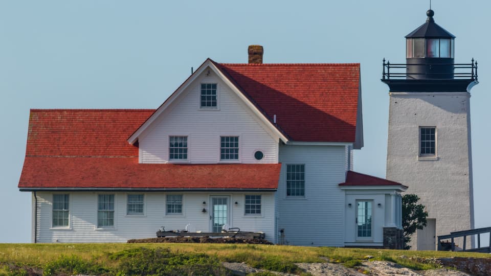 Hendricks Head Lighthouse in Southport, Maine marks the west side of the Sheepscot River, on a summer morning from kayak pov