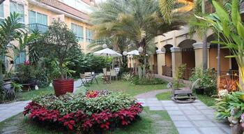 A charming boutique hotel in Khon Kaen, Thailand. It is situated in the city center, but set off the road enough that you do not get noise from the street traffic. It's very serene and the spacious balconies are a great place to relax. Good breakfast buffet too!
For more info on our stay at Piman Garden Boutique Hotel, please visit http://thetradingtravelers.com/hotel-review-in-khon-kaen-piman-garden-boutique-hotel/