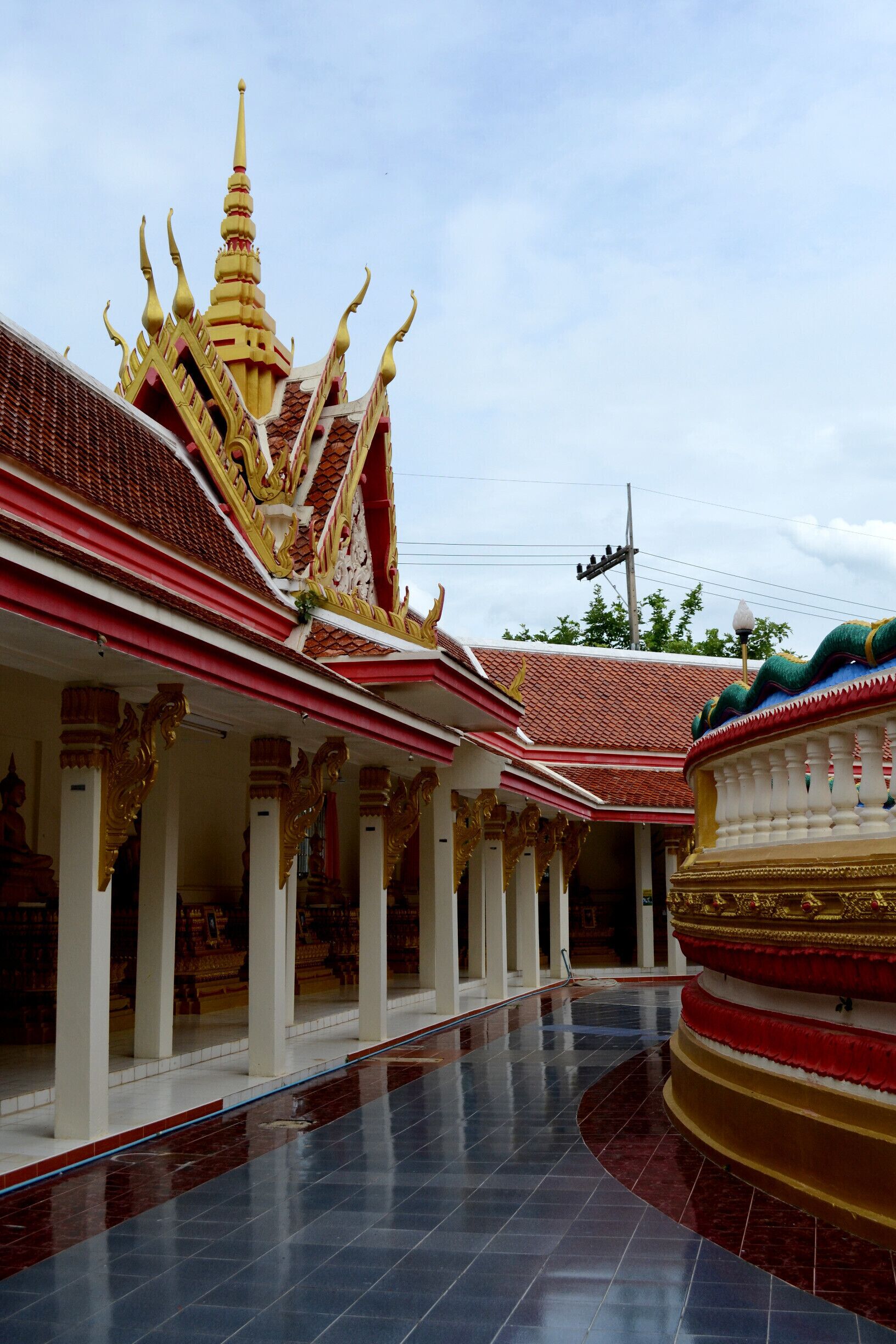 Dominated by a brick red stuppa, Wat That's focus is on education. On the grounds, you will find a school for young monks. The area surrounding the stuppa hosts exhibitions about the history of E-san. After paying your respects to the Buddha, you can cross the street to the lake and take a leisurely stroll around it.

#architecture #stunningstructures
