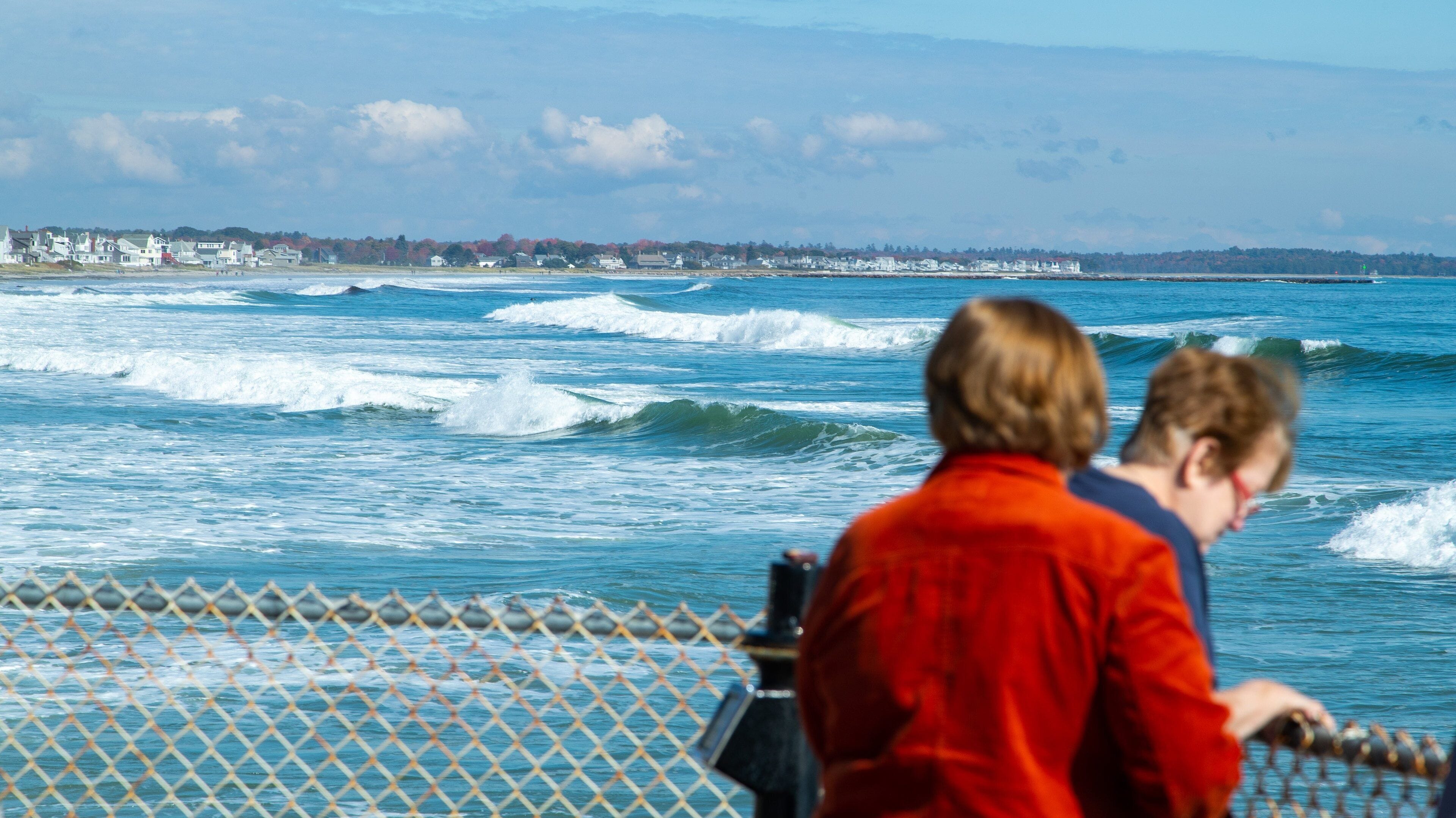 A coastal town with a view of the ocean and waves.