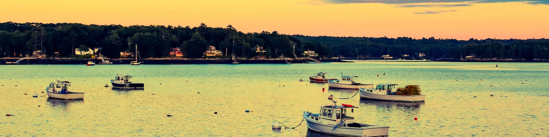 Lobster boats moored in the Sheepscot River at the Wiscasset Waterfront at sunset