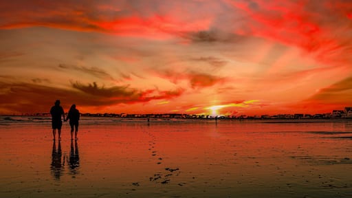 Tranquil summer sunset seascape panorama in silhouette on the Fortunes Rocks Beach, a popular family outdoor activities in Biddeford, York County, Maine, USA