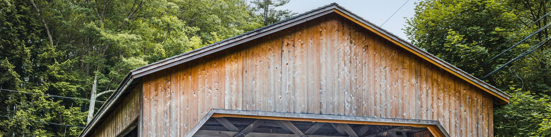 Historic Bissell Covered Bridge in Charlemont, Massachusetts, USA, a reconstructed wooden bridge spanning Mill Brook