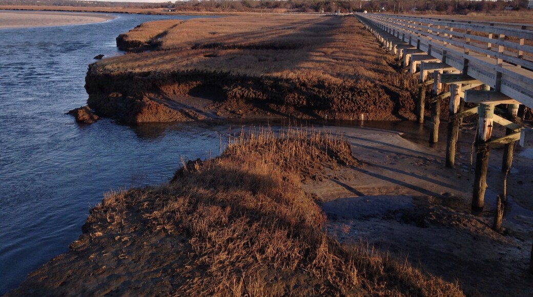 Gray's Beach aka to locals as "Bass Hole." It's a lovely spot for a sunset. The boardwalk overlooks dunes and marshland that changes with the tides and seasons. There are many trails nearby for walking. The beach is nice in summer, shallow for the kiddies.