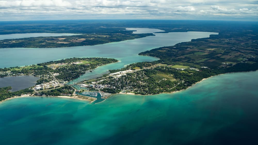 Aerial of Elk Rapids, Elk Lake, and Lake Michigan.