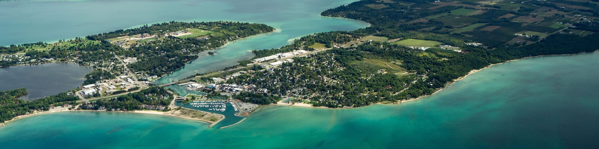 Aerial of Elk Rapids, Elk Lake, and Lake Michigan.