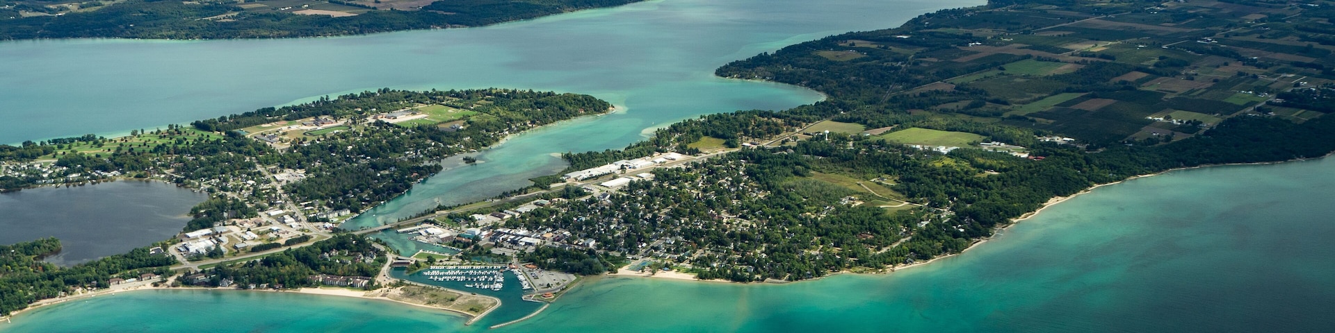 Aerial of Elk Rapids, Elk Lake, and Lake Michigan.