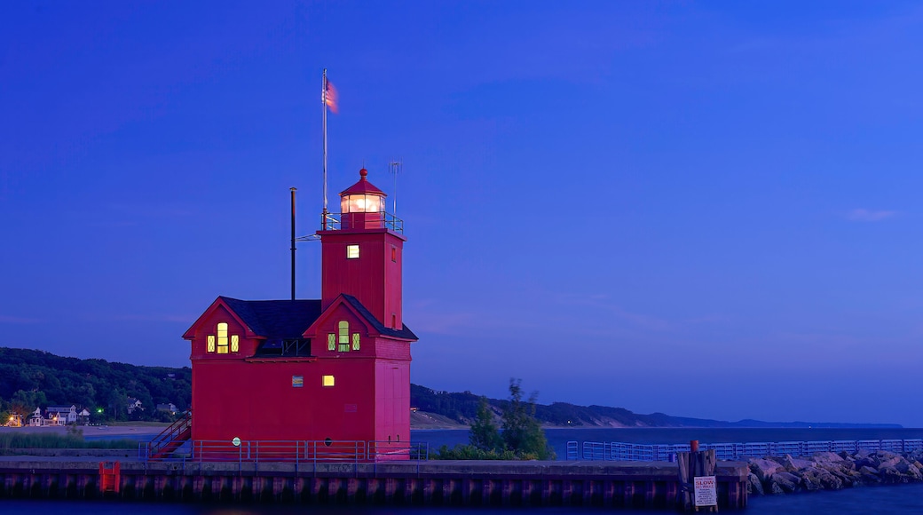 red lighthouse at night