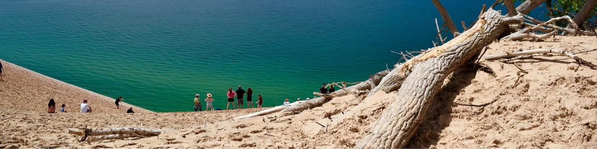 A view of Lake Michigan along the Pierce-Stocking Scenic Drive in Sleeping Bear Dunes National Lakeshore. The water is such a beautiful blue, with greens and teals nearer the shore. You can hike the dunes to the beach below, but be forewarned, the dunes are 2,000 feet high. It takes hours to climb back up, and often people have to be rescued because they can’t make the climb. #blue #green #AquaTrove #BVSBlue #AboveItAll