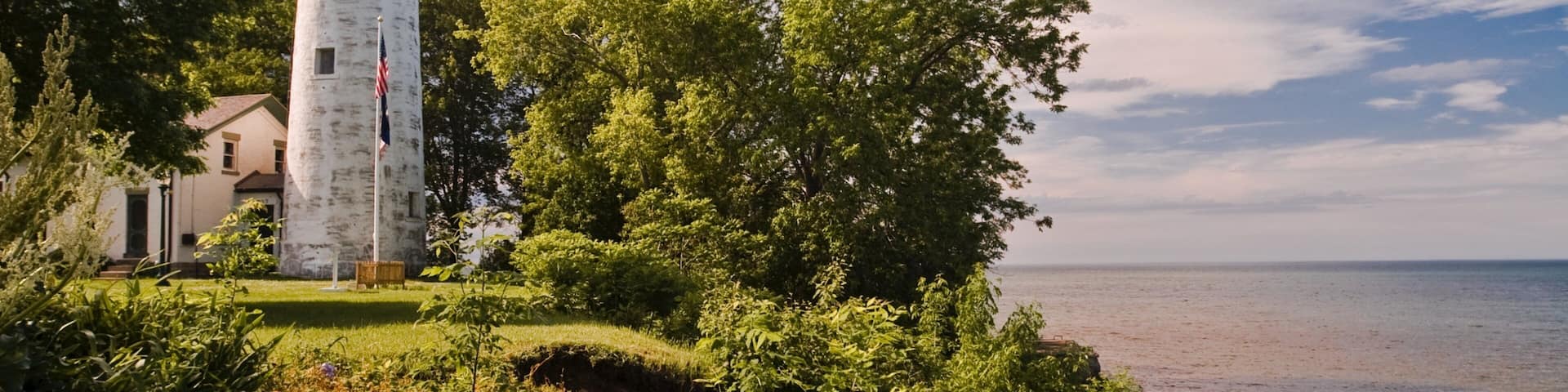 Port Austin featuring a lighthouse and general coastal views