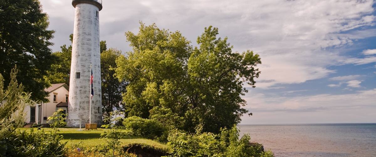 Port Austin featuring a lighthouse and general coastal views