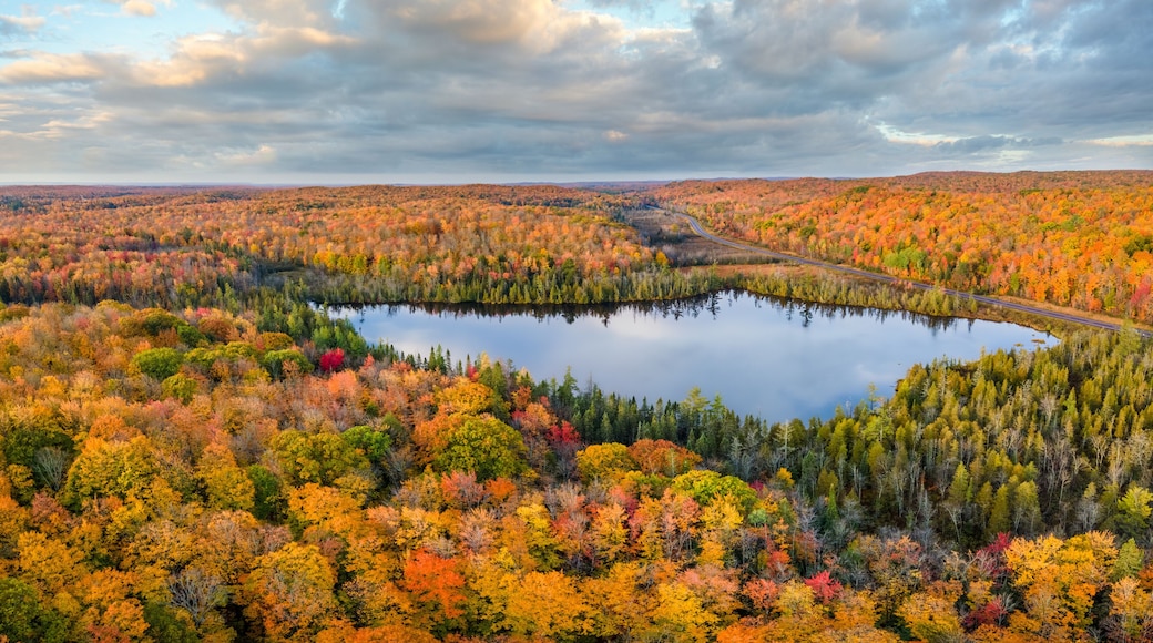 Autumn aerial view of Donken lake on the drive through the tunnel of Trees in Michigan Upper Peninsula UP - Highway 41 M26 Aerial view