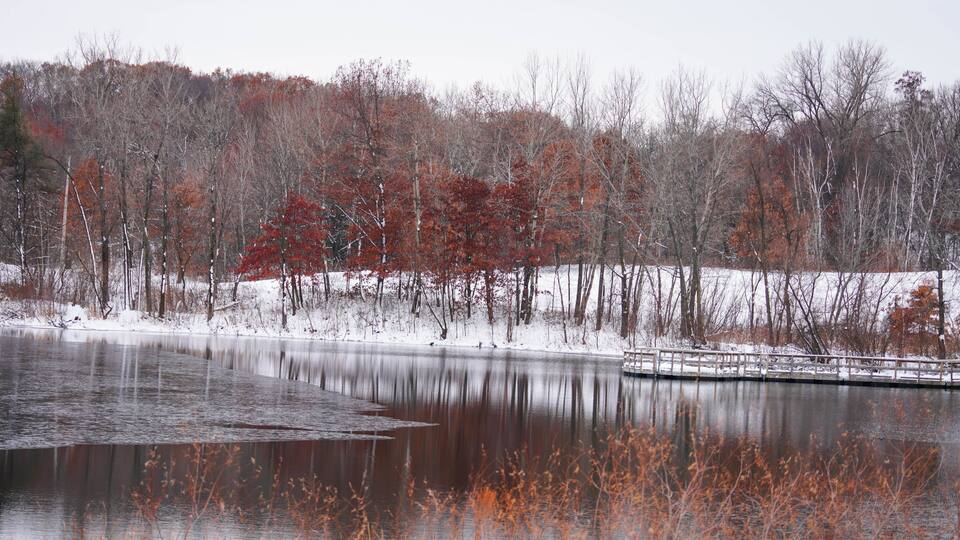 Reflections on a lake after a snow fall
