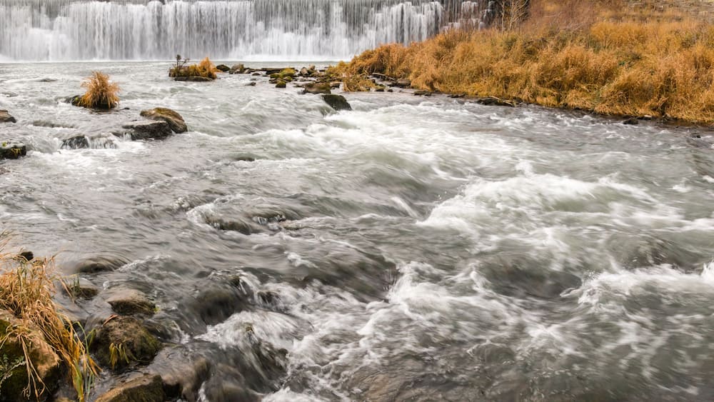 The Root River Drops Over Root River Falls and the Historic Dam in Laneboro, Minnisota, USA