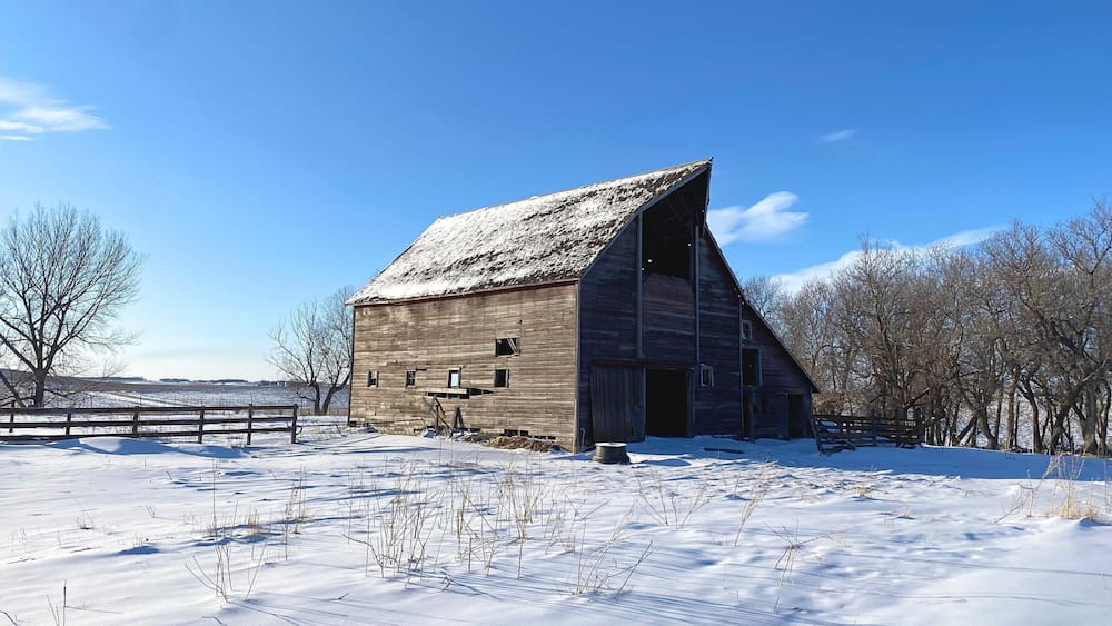 A barn in the snow, long abandoned but not forgotten