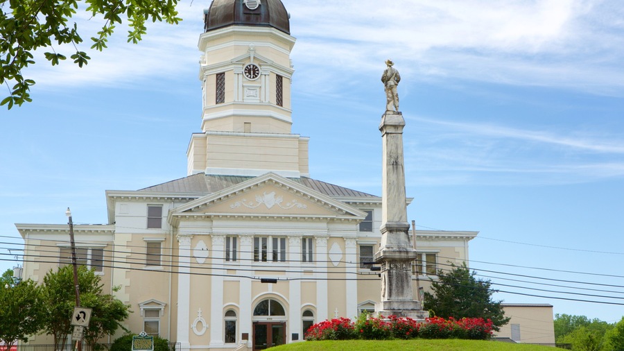 Port Gibson featuring a statue or sculpture, an administrative buidling and heritage architecture