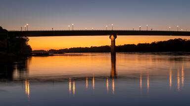 silhouette of the bridge over Missouri River at Hermann, MO, after sunset