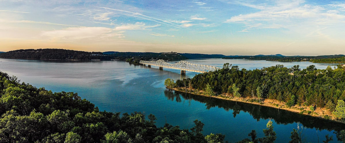 Panoramic Lake at Sunrise with Bridge