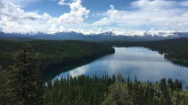Beautiful hike, with holland lake right by you with the clearest water. Beautiful views the whole way and an amazing view at the top with a gorgeous waterfall! Able to climb up the side of the water fall, but be careful itâs very steep and you could slip and fall!