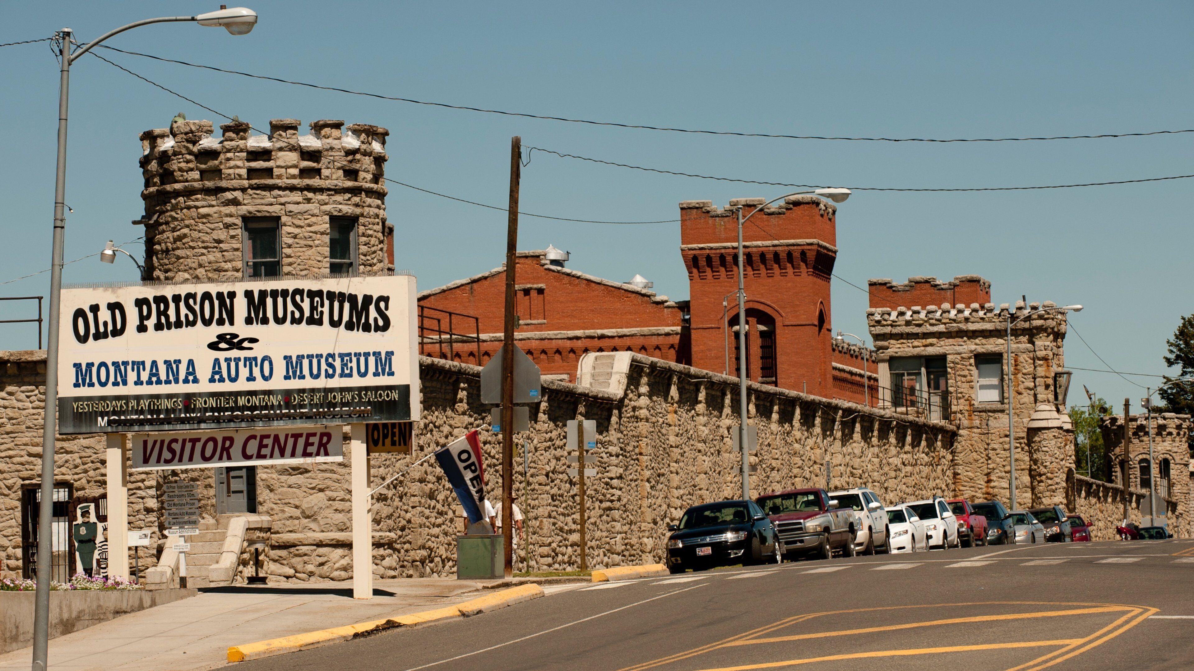 Deer Lodge which includes street scenes and signage