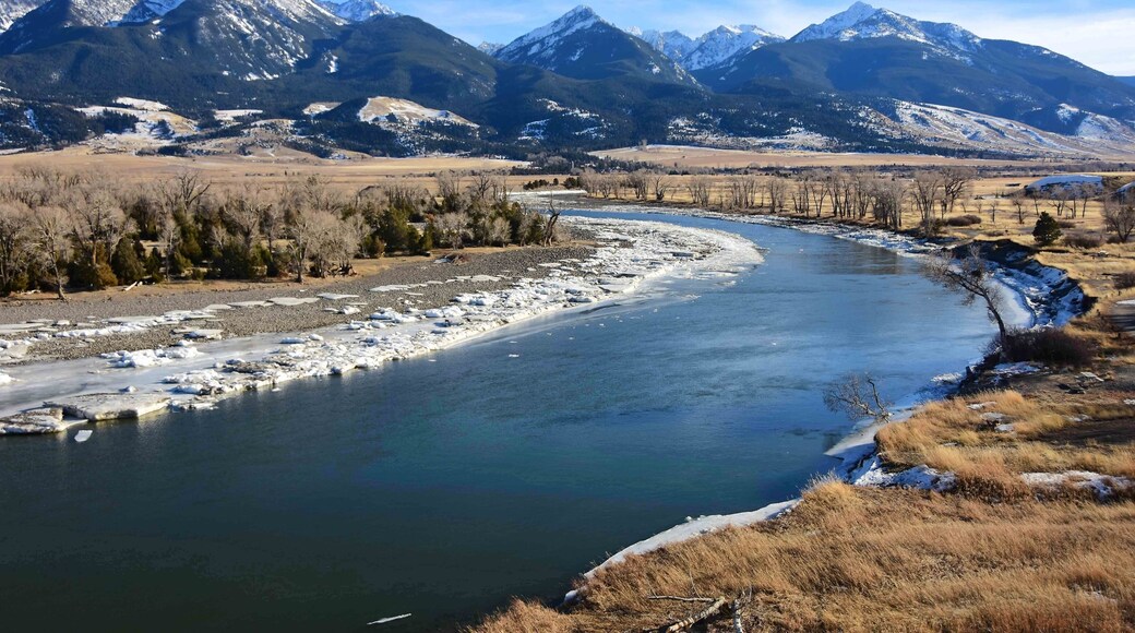 scenic winter landscape on a sunny day at mallard's rest fishing access along the paradise valley scenic loop of the yellowstone river and gallatin range, south of livingston, montana