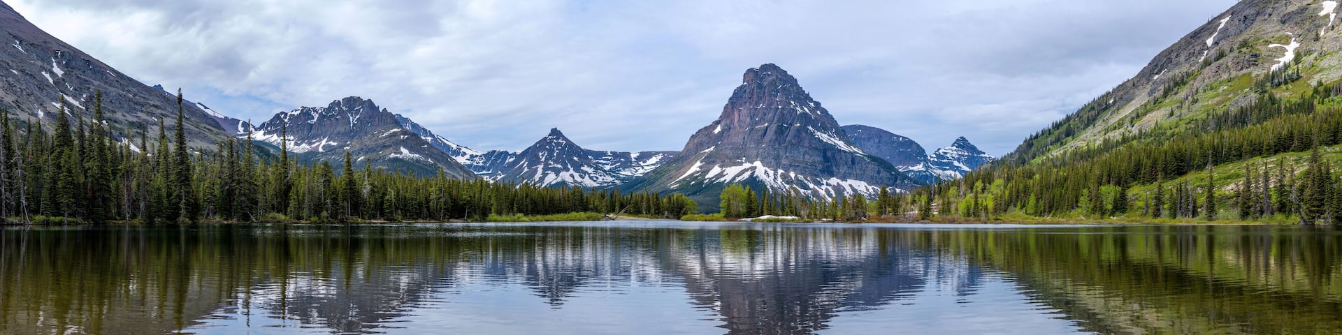 Pray Lake - A panoramic Spring morning view of Pray Lake and its surrounding mountains at Two Medicine Valley, Glacier National Park, Montana, USA.
