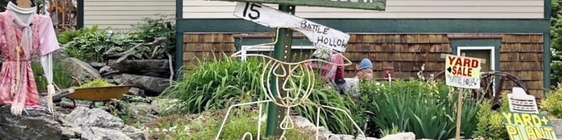 There was a church at this lot which burned down so the present owner built a smaller version for their home and used the original bell. She sells art and plants. (June 2019)