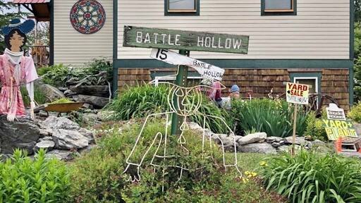 There was a church at this lot which burned down so the present owner built a smaller version for their home and used the original bell. She sells art and plants. (June 2019)