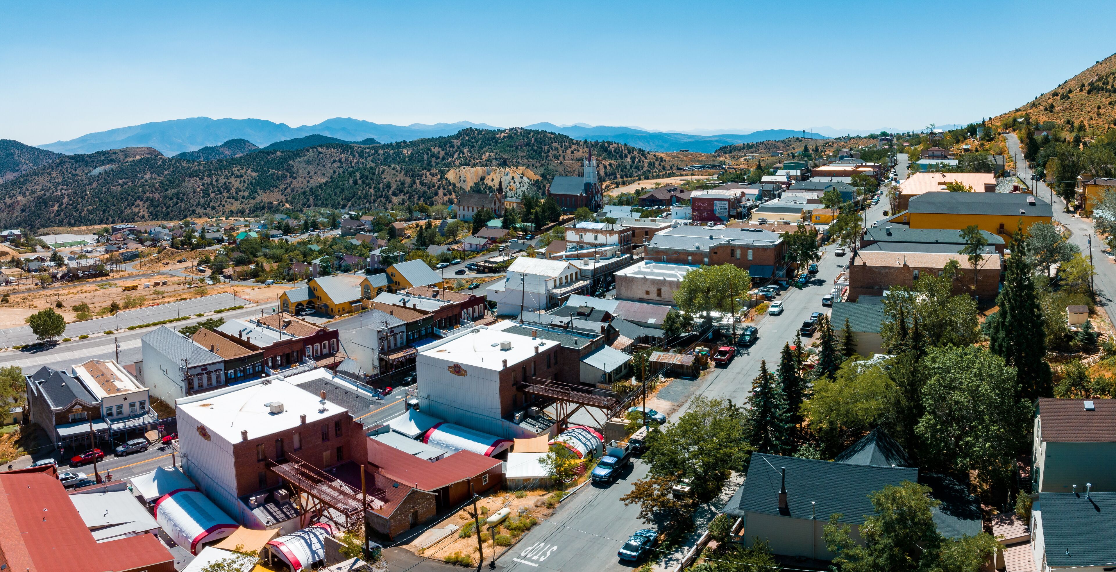 Aerial scenic view of Victorian building on historic Main C street in downtown Virginia City. Cars parked along the street of Virginia, Nevada, USA