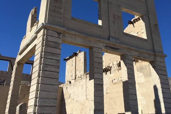 Ancient ruins with large stone blocks and columns.