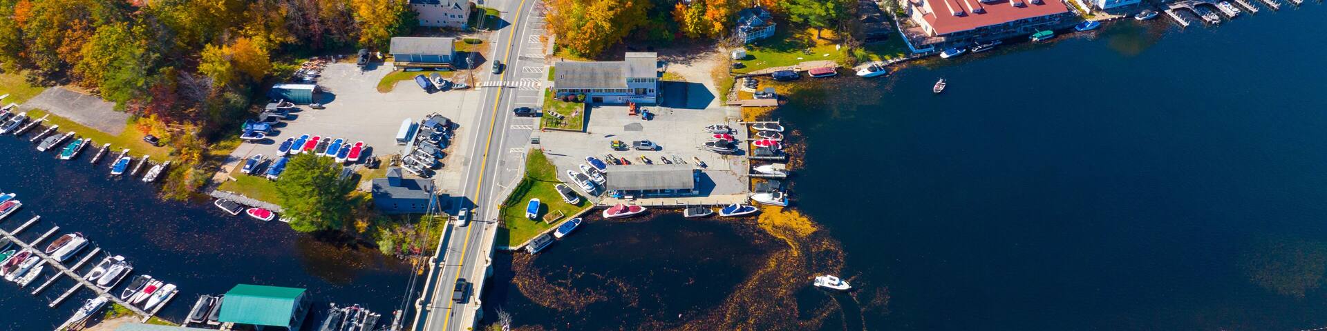 Alton Bay at Lake Winnipesaukee aerial view on Harmony Park and village of Alton Bay in fall in town of Alton, New Hampshire NH, USA.