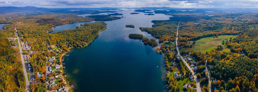 Panoramic aerial view of Center Harbor Bay in Lake Winnipesaukee in fall from town center of Center Harbor, New Hampshire NH, USA.