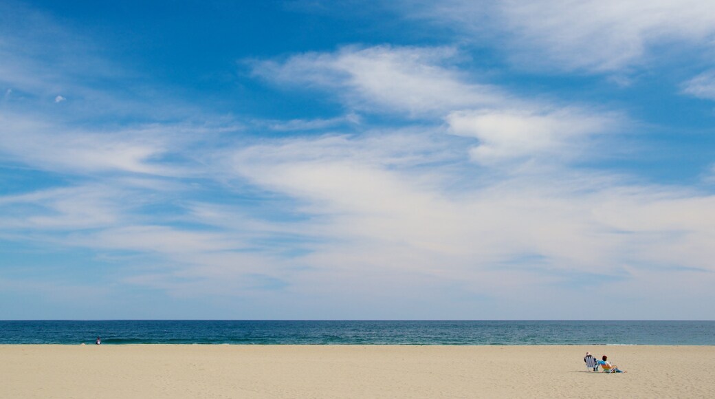 Hampton Beach featuring a sandy beach as well as a couple