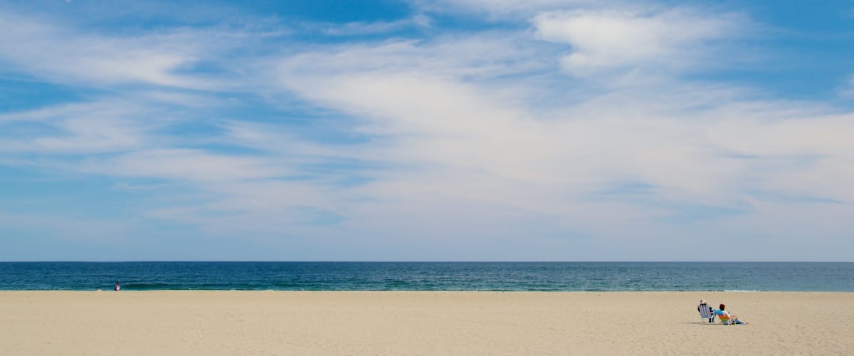 Hampton Beach featuring a sandy beach as well as a couple