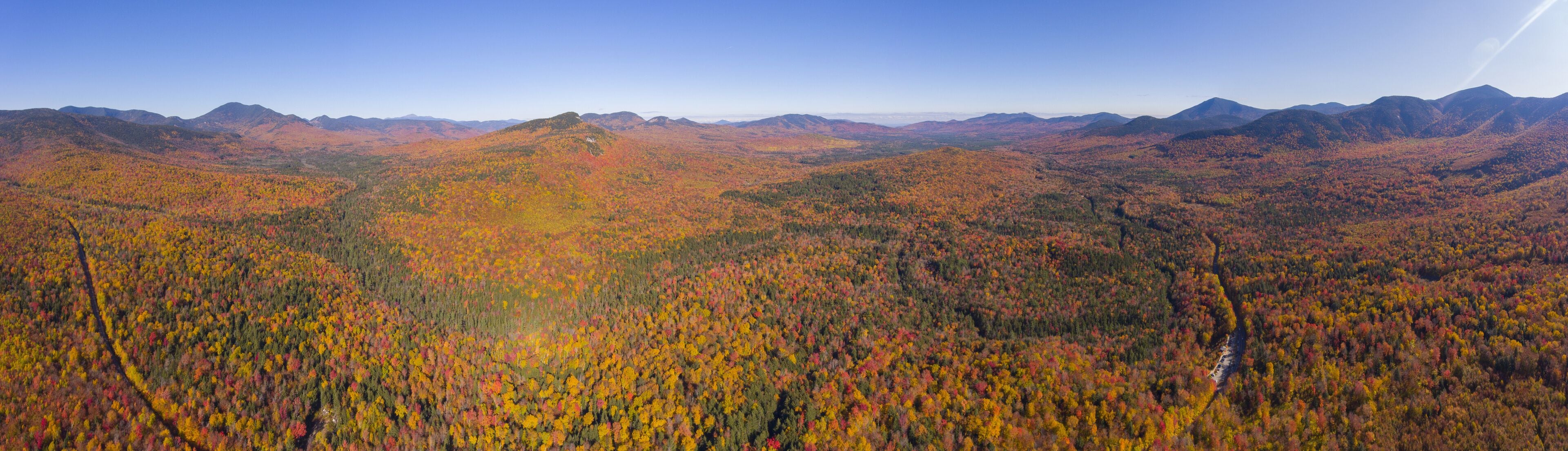 White Mountain National Forest fall foliage on Kancamagus Highway panorama aerial view near Sugar Hill Scenic Vista, Town of Lincoln, New Hampshire NH, USA.
