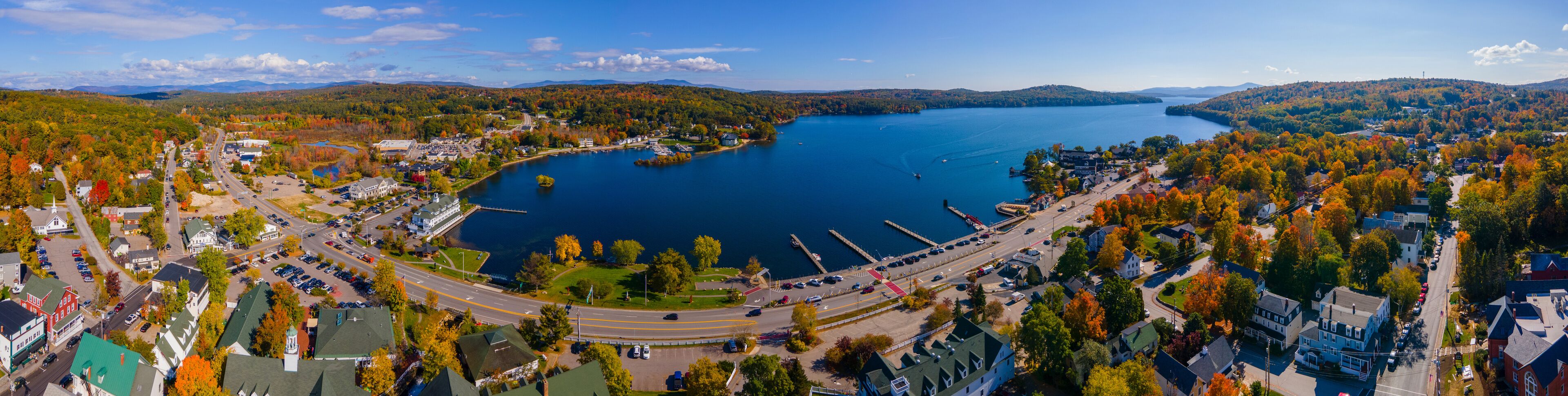 Panoramic aerial view of Meredith Bay in Lake Winnipesaukee and Meredith town center in fall, New Hampshire NH, USA. 