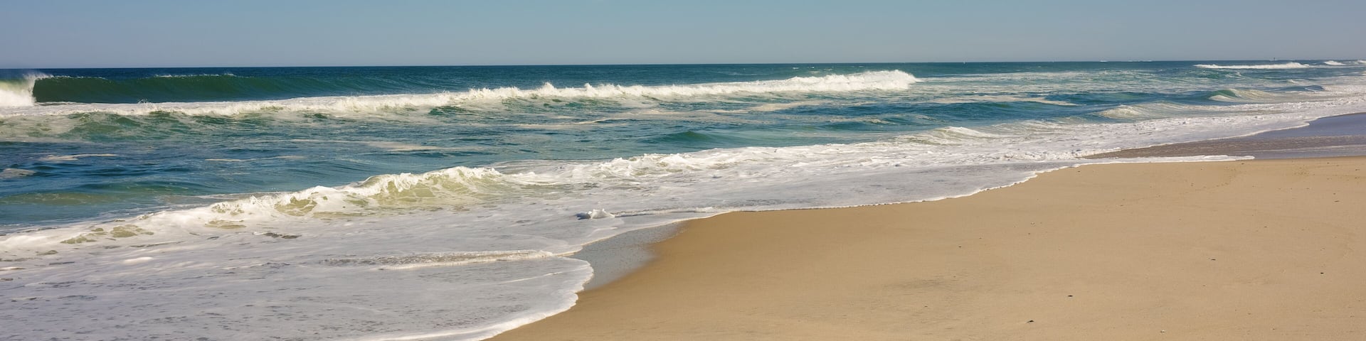 Nearly empty beaches on Island Beach state park in New Jersey the day the beaches opened during the covid-19 pandemic