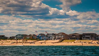 Beach houses and people on the beach in Point Pleasant, New Jersey.