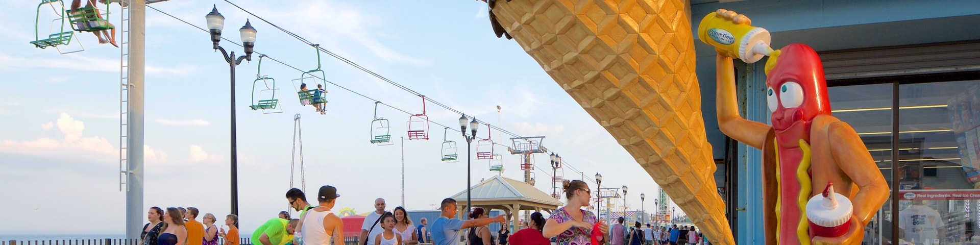 Seaside Heights featuring a gondola as well as a large group of people