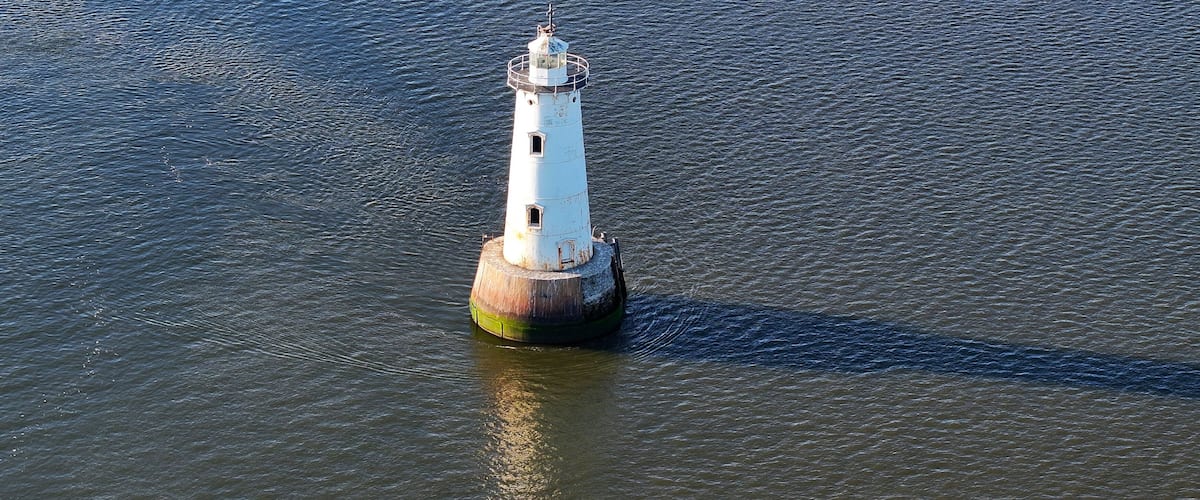 Aerial view of ocean facing view of the Great Beds lighthouse in South Amboy, New Jersey
