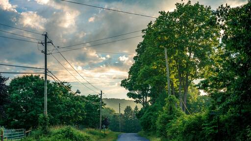 Hazy sunset over country road in the mountains upstate NY