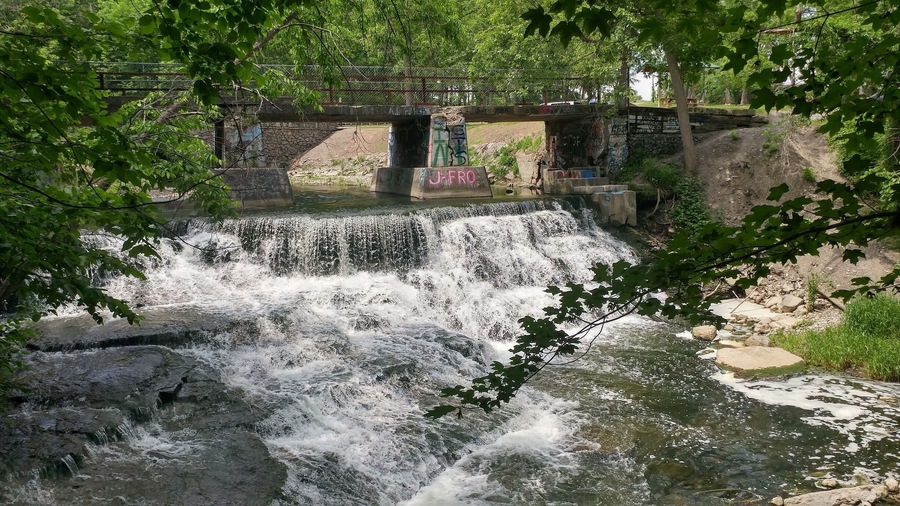 Papermill Falls with a graffiti bridge.