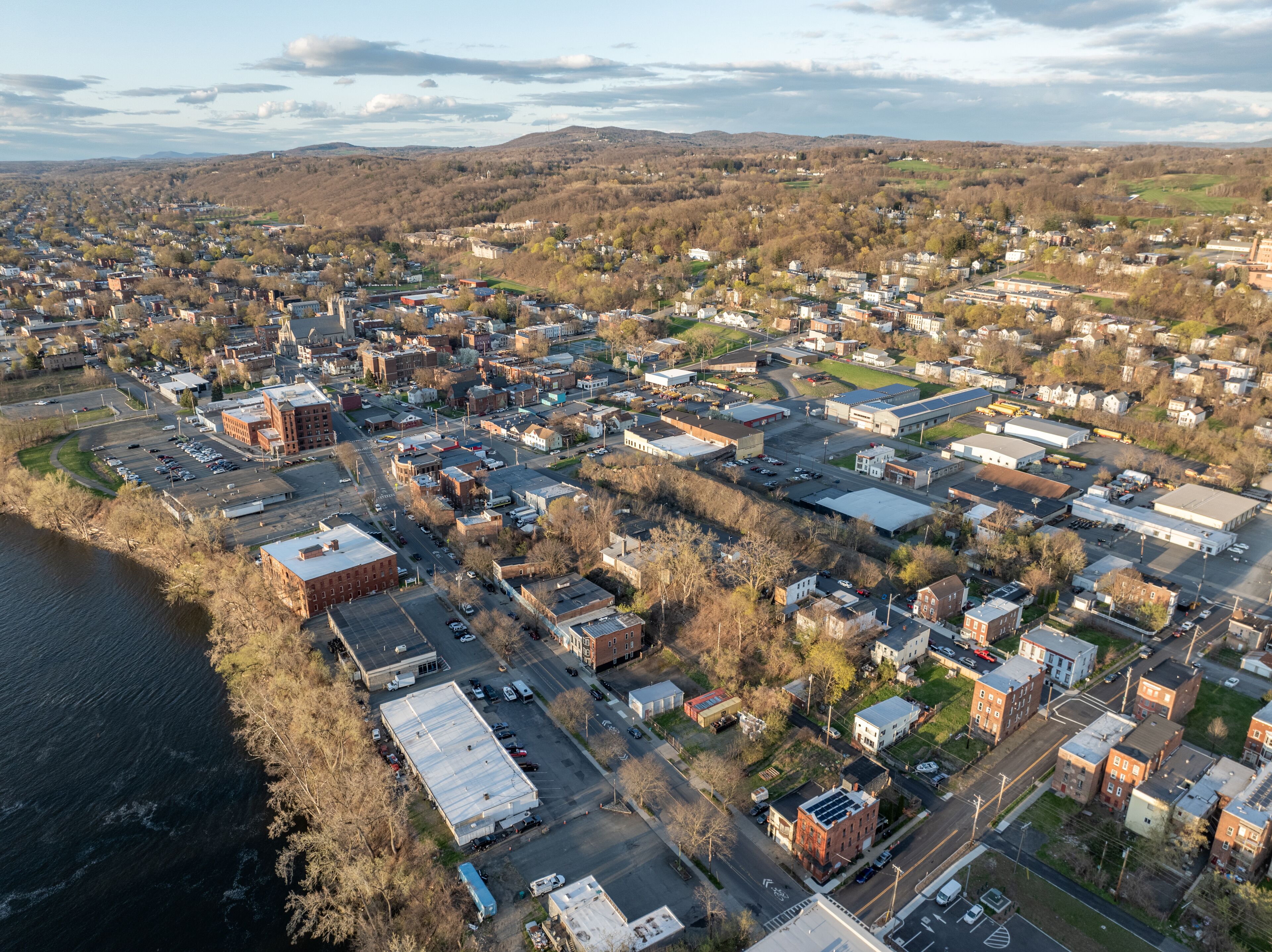 Late afternoon spring aerial view of downtown Troy, NY located on the Hudson River.